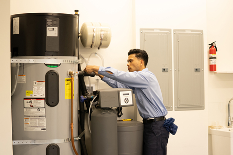 technician inspecting heat pump