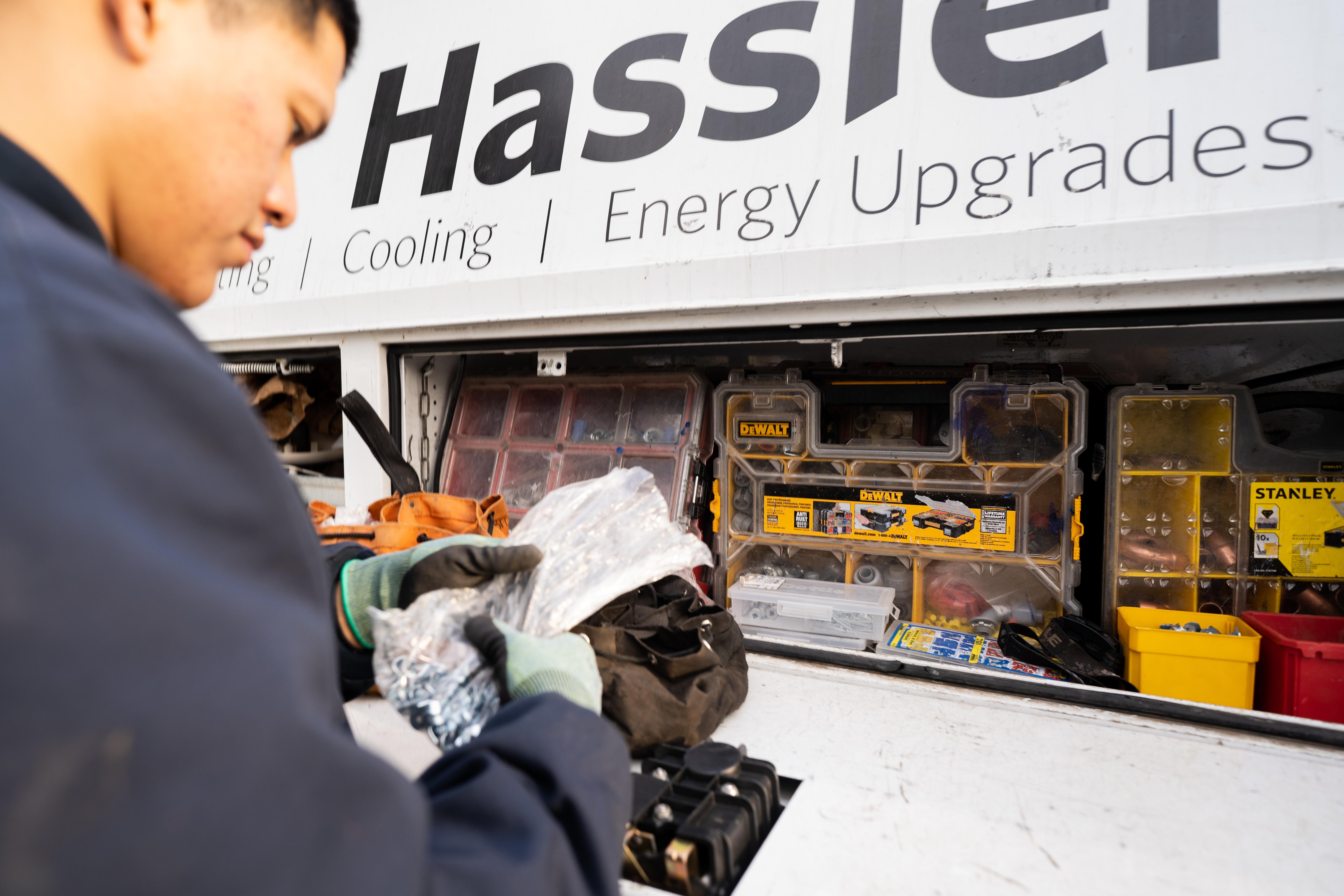 Hassler tech working inside a truck