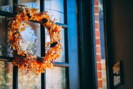 autumn wreath on the door of home